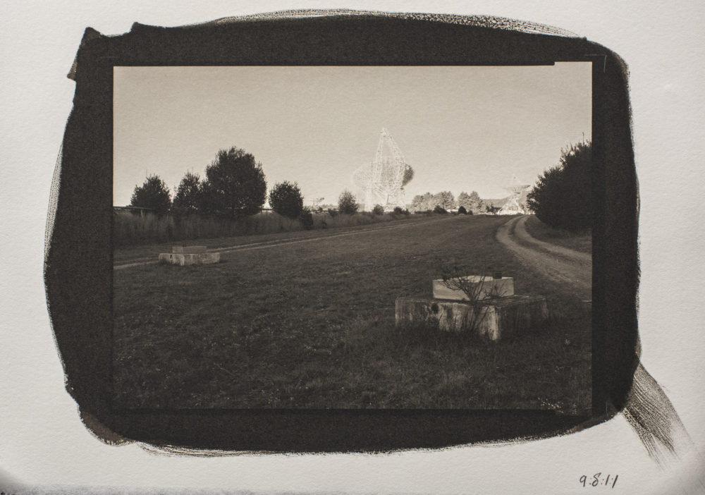 A platinum/palladium print of a sunset shot taken from the interferometry road between the 85-2 and 85-3 telescopes, with the Green Bank Telescope in the Background, at Green Bank National Radio Astronomy Observatory